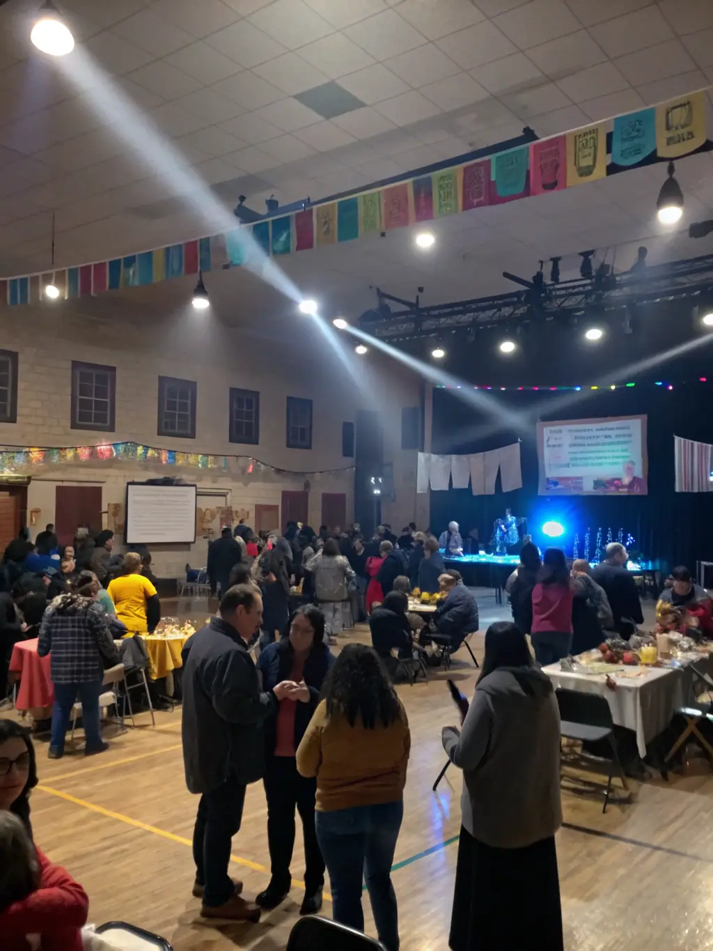 A photograph capturing a community event at the museum, with people of all ages interacting and sharing stories related to radio and phonograph history, illustrating the museum's commitment to strengthening social connections.